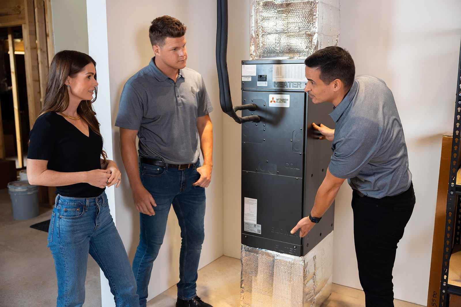 Superior CO-OP HVAC technicians installing a Mitsubishi ducted air handler