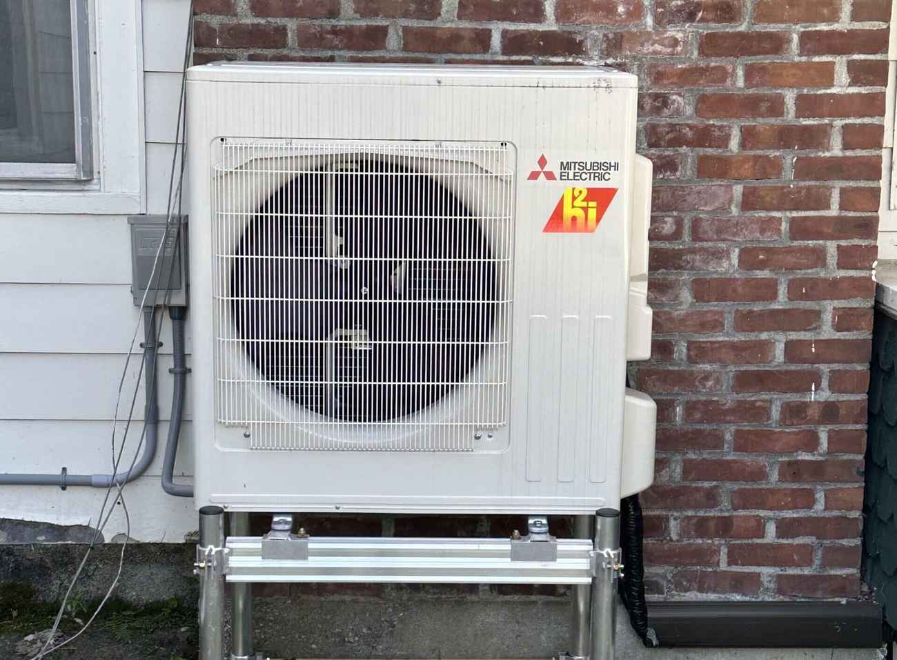 Mitsubishi Hyper-Heat outdoor unit on a Vermont home